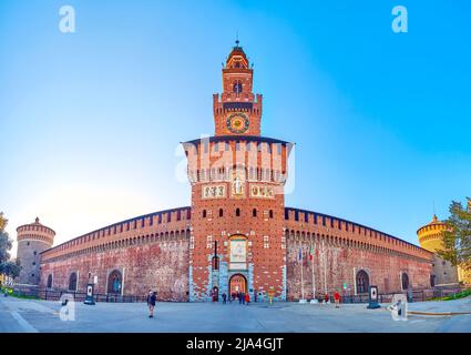MILAN, ITALY - APRIL 5, 2022: Panorama of the main facade of Sforza's Castle with its main tower Torre del Filarete, serving as the entrance, on April Stock Photo