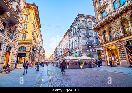 MILAN, ITALY - APRIL 5, 2022: Walk along Via Dante, one of the popular shopping areas of the city, on April 5 in Milan, Italy Stock Photo