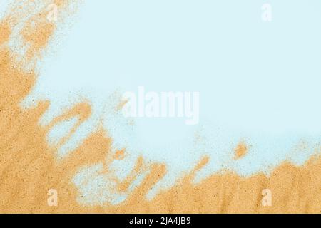 Sand on a light blue background beach shape in a top view Stock Photo