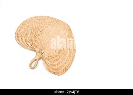 A straw pai pai fan on a white background with copy space Stock Photo