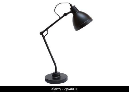 Black electric metal lamp isolated on a white background. Reading, modern desk lamp. Minimalistic interior decoration object. Stock Photo