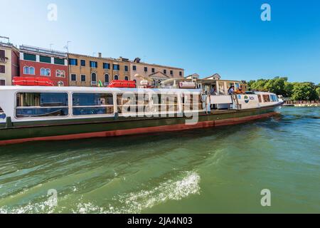 Actv (Municipal Company for Public Transport) Ferry Boat or Vaporetto with tourists in motion in the Venice Lagoon, Grand Canal. Veneto, Italy, Europe Stock Photo