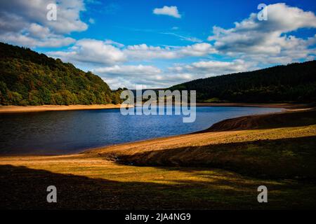 dry mud planes at the base of Ladybower Reservoir after a dry summer, Peak District UK 2021 Stock Photo