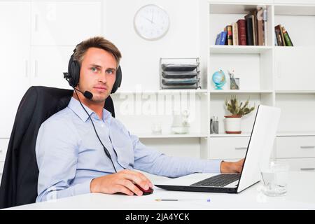 Operator answering at call center Stock Photo