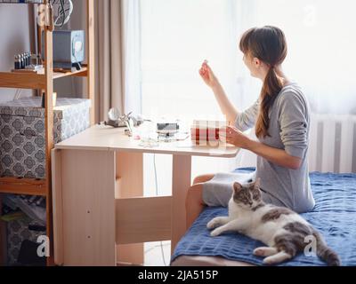 Lifestyle concept, work from home to reinvent your life - Jewelry designer workplace. Woman make jewelry. Georgian minankari enamel manufacturing tech Stock Photo