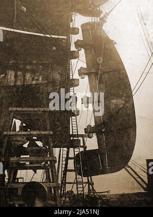 The 55+ ton rudder of the RMS Berengaria being hoisted into place.    The Cunard liner Berengaria ( formerly SS Imperator) was the largest passenger ship in the world.-  Between 1934 and 1938 the vessel sailed the Southampton to New York  route via Cherbourg. During the years of US prohibition, Berengaria was used for discounted Prohibition-dodging cruises, which attracted the nickname 'Bargain-area' Stock Photo