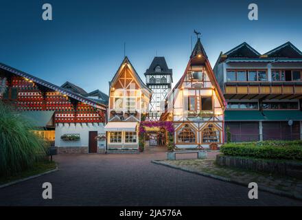 Capivari fachwerk buildings illuminated at night - Campos do Jordao, Sao Paulo, Brazil Stock Photo