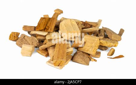 Wood chips for smoking meat and fish isolated on white background. Pile of oakand fruit tree chips Stock Photo