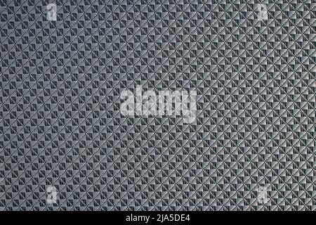 Close up of gray synthetic textured fabric with a rhombus pattern used to make blinds. Template design or polyester material abstract background Stock Photo