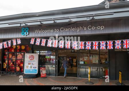 Queen Elizabeth II Platinum Jubilee bunting, Cranleigh Co-op supermarket decorations, Surrey, England, UK, 2022 Stock Photo