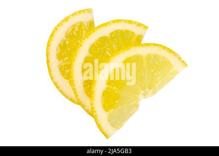Three slices of lemon yellow colour sliced in halves Stock Photo