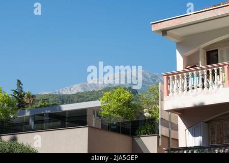 View of the mountain against the blue sky in the village of Herceg Novi in Montenegro. Summer rest. Stock Photo