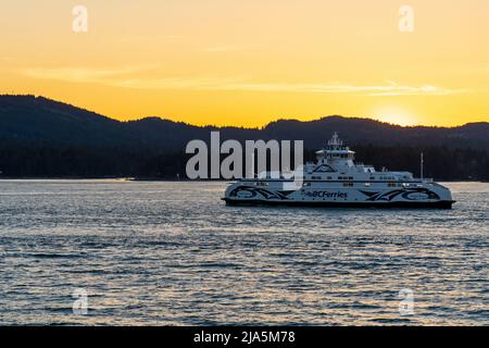 British Columbia, Canada - April 14 2021 : BC Ferries, Sunset sky over the pacific ocean, Southern Gulf Islands, Swartz Bay, Strait of Georgia. Stock Photo