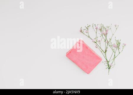 Natural handmade soap bar and flowers, spa organic soap on white background Stock Photo