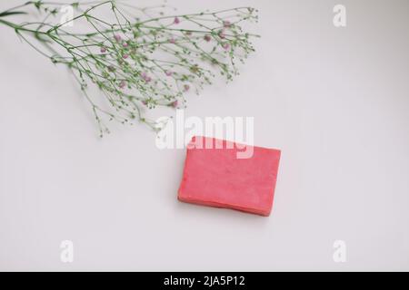 Natural handmade soap bar and flowers, spa organic soap on white background Stock Photo