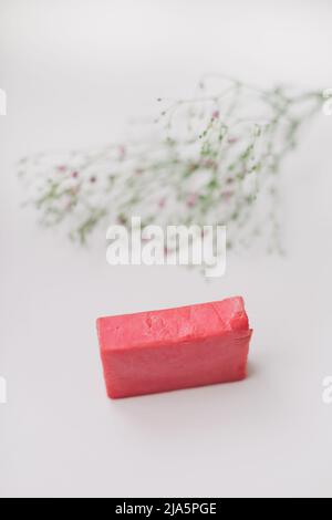 Natural handmade soap bar and flowers, spa organic soap on white background Stock Photo