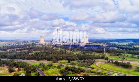 Close-up wide view of Bayswater power plant electricity station in Hunter valley of Australia - aerial landscape of industrial plant. Stock Photo