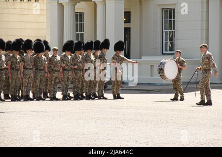 London, UK. 27th May, 2022. A troop of Soldiers rehearses at Wellington Barracks for the Trooping the Colour parade. The event is scheduled for 2nd June 2022, where more than 1,400 parading soldiers, 200 horses, and 400 musicians will come together in the traditional Parade to mark The Queen's 70-year reign. The Platinum Jubilee celebration will include street parties, London's Trooping the Colour, Service of Thanksgiving, concerts, and pageants which will be celebrated over four day period. Credit: SOPA Images Limited/Alamy Live News Stock Photo