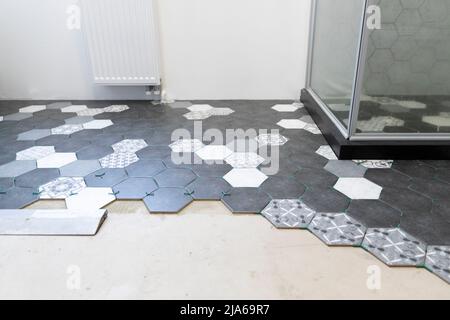 House improvement, different type of tiles on the floor in a bathroom Stock Photo