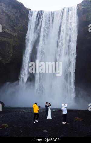 Wedding photoshoot at Skógafoss waterfall, Iceland Stock Photo
