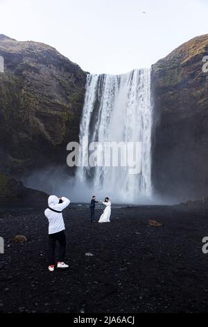 Wedding photoshoot at Skógafoss waterfall, Iceland Stock Photo