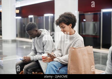 casual young people waiting for a subway train . Stock Photo
