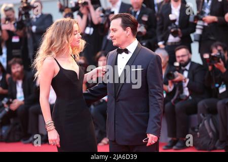 September 04, 2015 Venice, Italy:Actress Amber Heard and actor Johnny Depp attend the 'Black Mass' premiere during 72 Venice Film Festival.(Manuel Sil Stock Photo