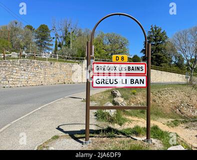 Gréoux-les-Bains, France - April 27, 2022: City entrance sign of Gréoux-les-Bains, a commune in the Alpes-de-Haute-Provence department in France. Stock Photo