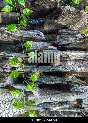 VERTICAL Fashion decor stone brick wall texture siding different size shape. Beautiful nature wallpaper. Romantic simple. Abstract grunge dark light Stock Photo