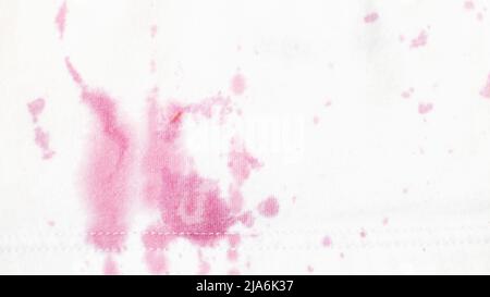 dirty stains on clothes from berries on a white background close. Stock Photo