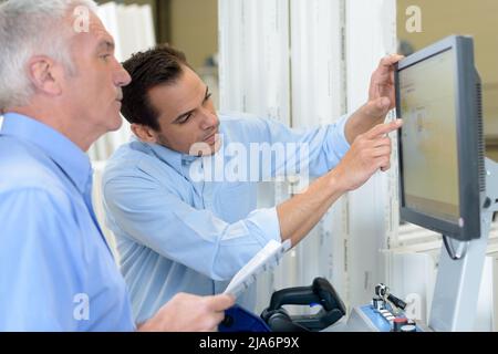 using icon on computer factory Stock Photo