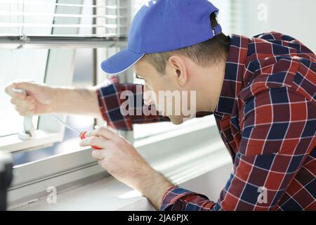 a specialist in installing plastic windows Stock Photo