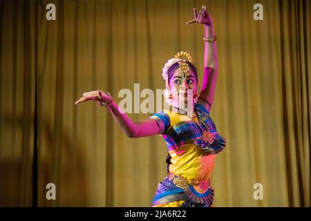 Indian Girl dancing Bhrathanatiyam on stage - Asian girl 20-25 years old. Stock Photo