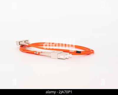 Fiber Optic Patch Cord on isolated white background Stock Photo