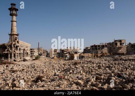 Darayya, Syria - April, 2022: Building ruins in destroyed city after the Syrian Civil War. Stock Photo