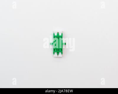 SC-UPC adapter for single mode fiber optic patch cord with flange on isolated white background Stock Photo