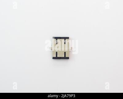 SC-UPC adapter for single mode fiber optic patch cord with flange on isolated white background Stock Photo