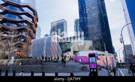 NEW YORK, NY, USA - APRIL 13, 2022 :  Vessel attraction located in Hudson Yard with other buildings and people around Stock Photo