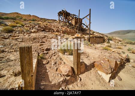 Entrance to Eureka Mine abandoned equipment in Death Valley desert Stock Photo