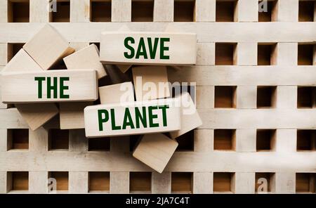 The concept of globalization. On the wooden blocks is written - Save the planet. Stock Photo
