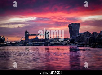 Low angle view over the Thames river to the skyline of the City of London Stock Photo