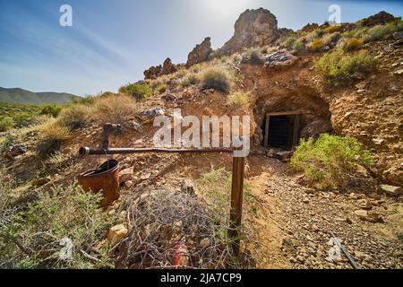 Abandoned mine in desert of Death Valley with shaft entrance Stock Photo