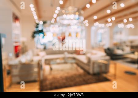 Home accessories and household products in store of shopping centre. View of home accessories for living room in shop fashion retail store. Sofa with Stock Photo