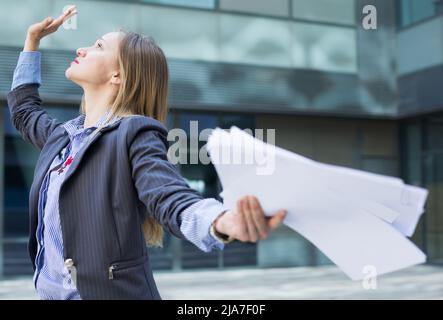 Professional woman in jacket working with documents Stock Photo