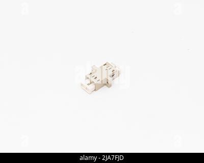 SC-UPC adapter for single mode fiber optic patch cord with flange on isolated white background Stock Photo