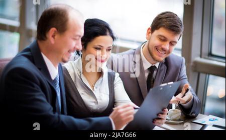 Business team working together to achieve better results Stock Photo