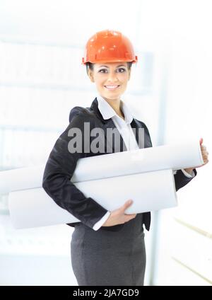 young female engineer with a roll of drawings Stock Photo