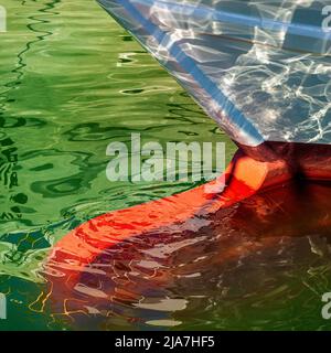 Keel of fishing boat and reflections in Sicily, Italy Stock Photo