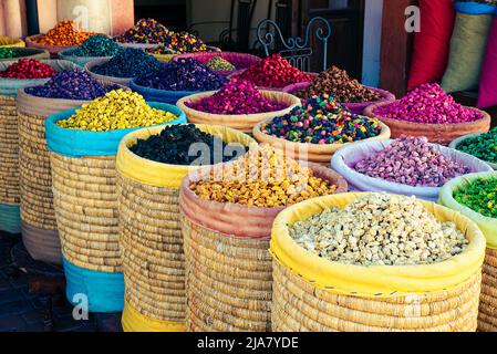 Different colored spices stored in open bags at an Arabic store in Morocco Stock Photo