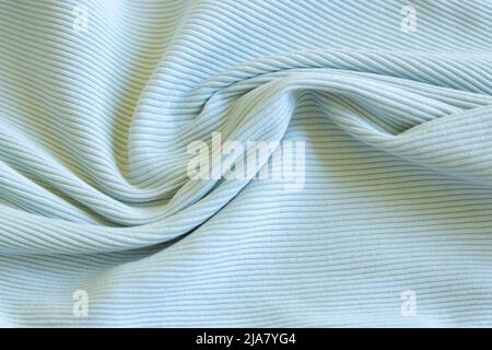 Light green, blue, mint show texture of ribbed cotton fabric wave. Close  up. Cotton clothing and textiles. Natural organic fabrics texture light  Stock Photo